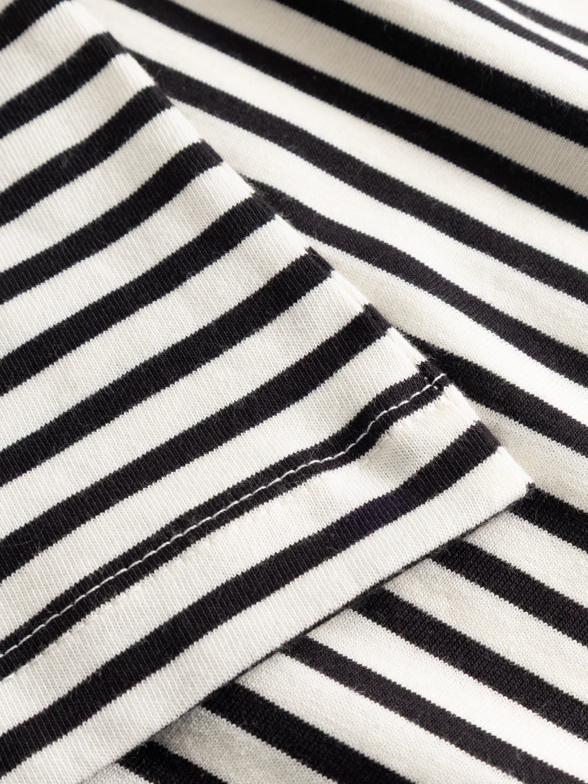 Maglia a righe con colletto a camicia in cotone biologico