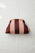 Clutch righe rosa bordeaux