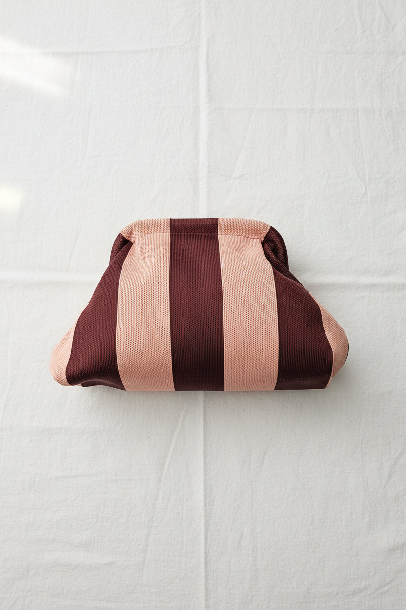 Clutch righe rosa bordeaux