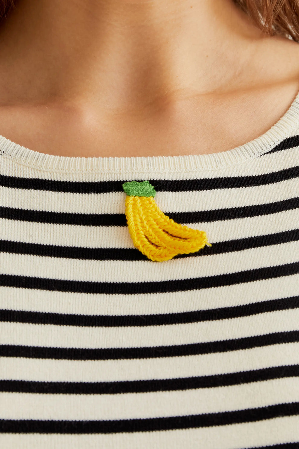 Black and white striped top with banana embroidery