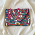 Maxi pochette  teal con perline  petali e ricami