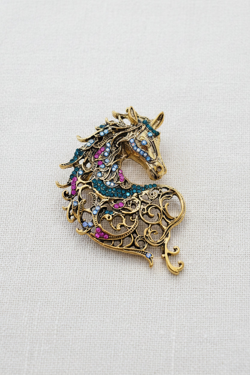 Horse brooch with filigree and coloured stones