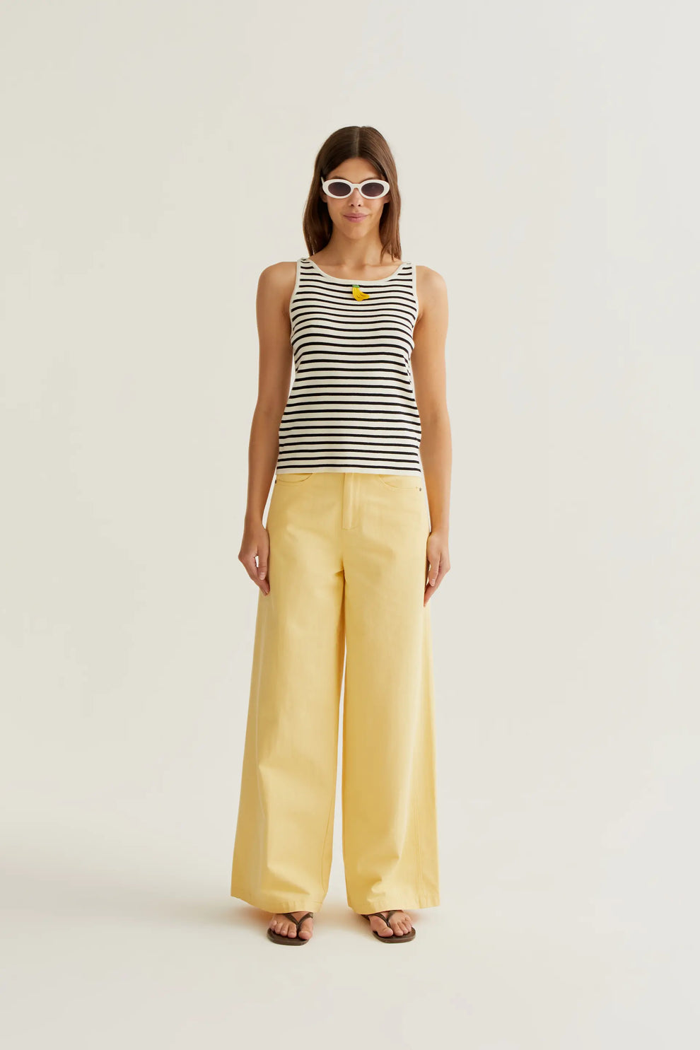 Black and white striped top with banana embroidery